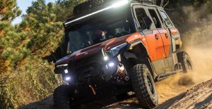 A person off-roading in a Polaris UTV