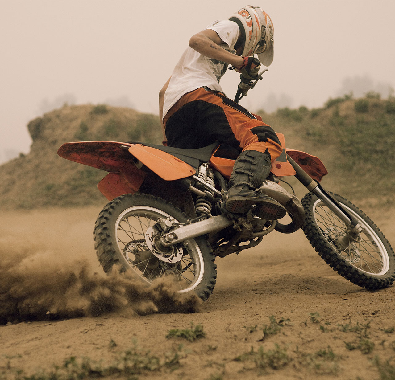 A person doing a trick on a dirt bike