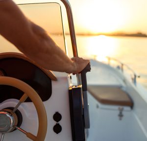 A hand on a boat throttle