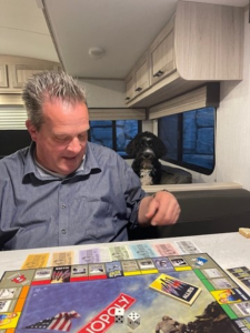 Brad in RV playing Monopoly