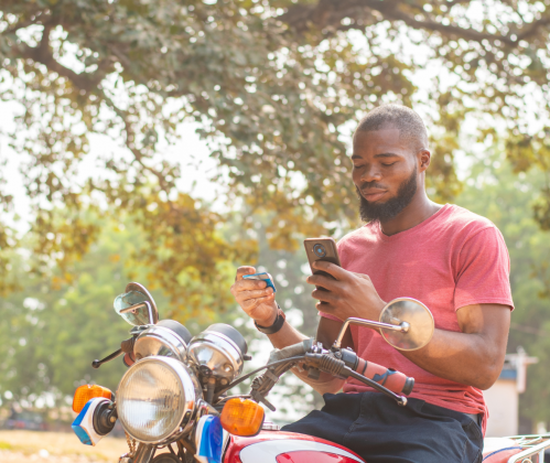 man on motorcycle withphone