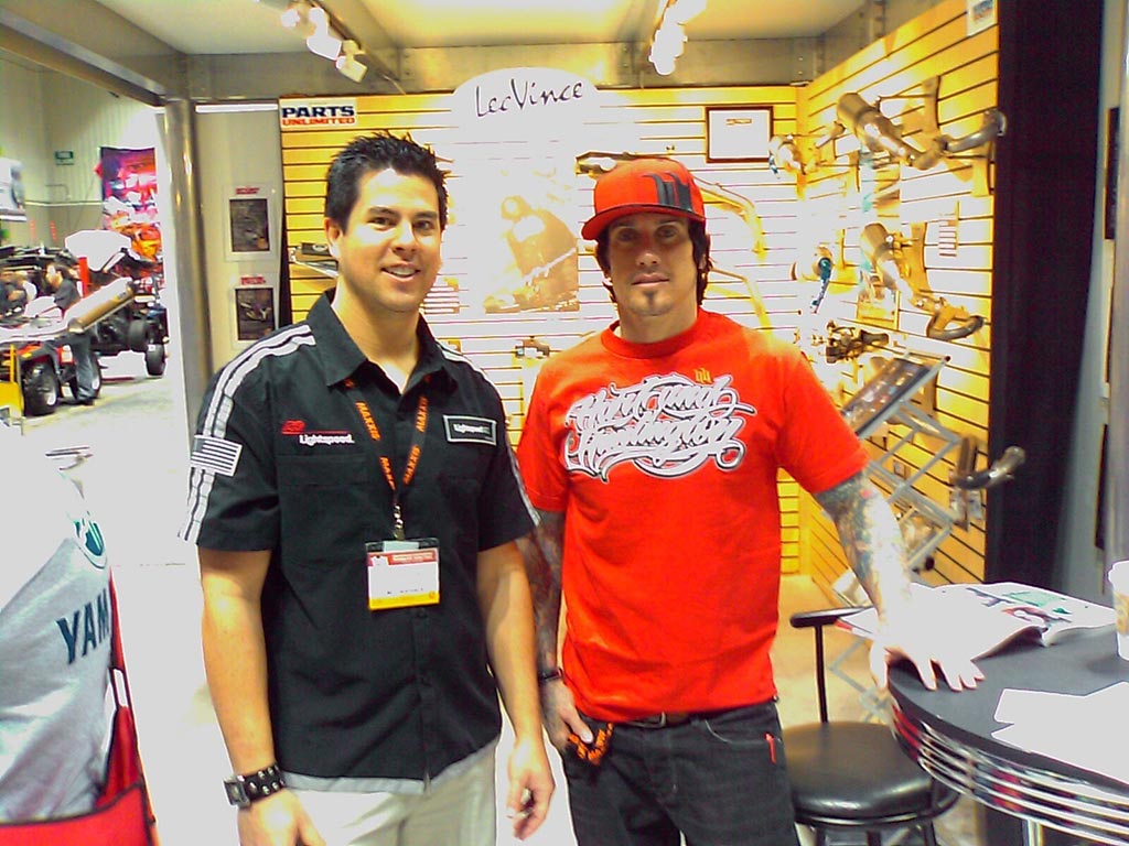 Image of Brian at an Indianapolis tradeshow with Carey Hart.