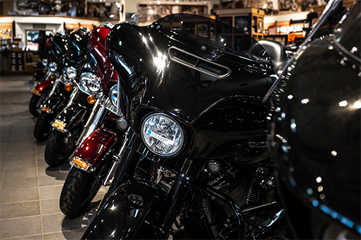 Image of parked motorcycles arranged in a line.