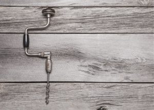 A hand drill on a table