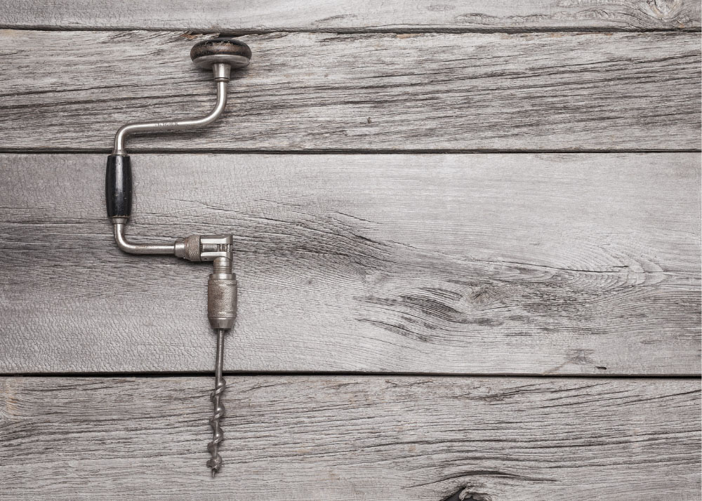 A hand drill on a table